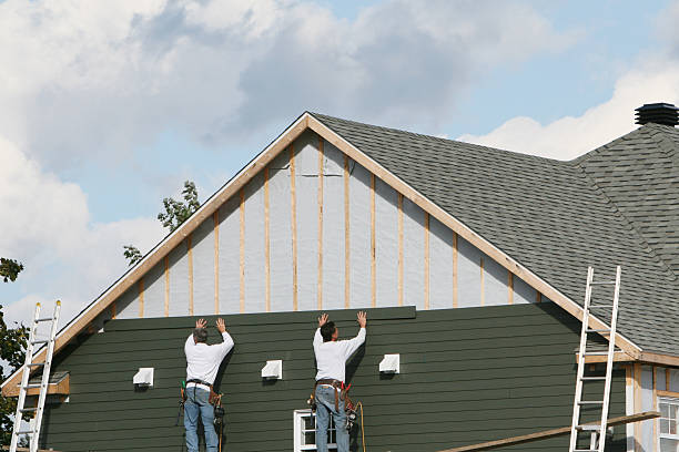 Professional Siding Repair technician working in Mineola, NY